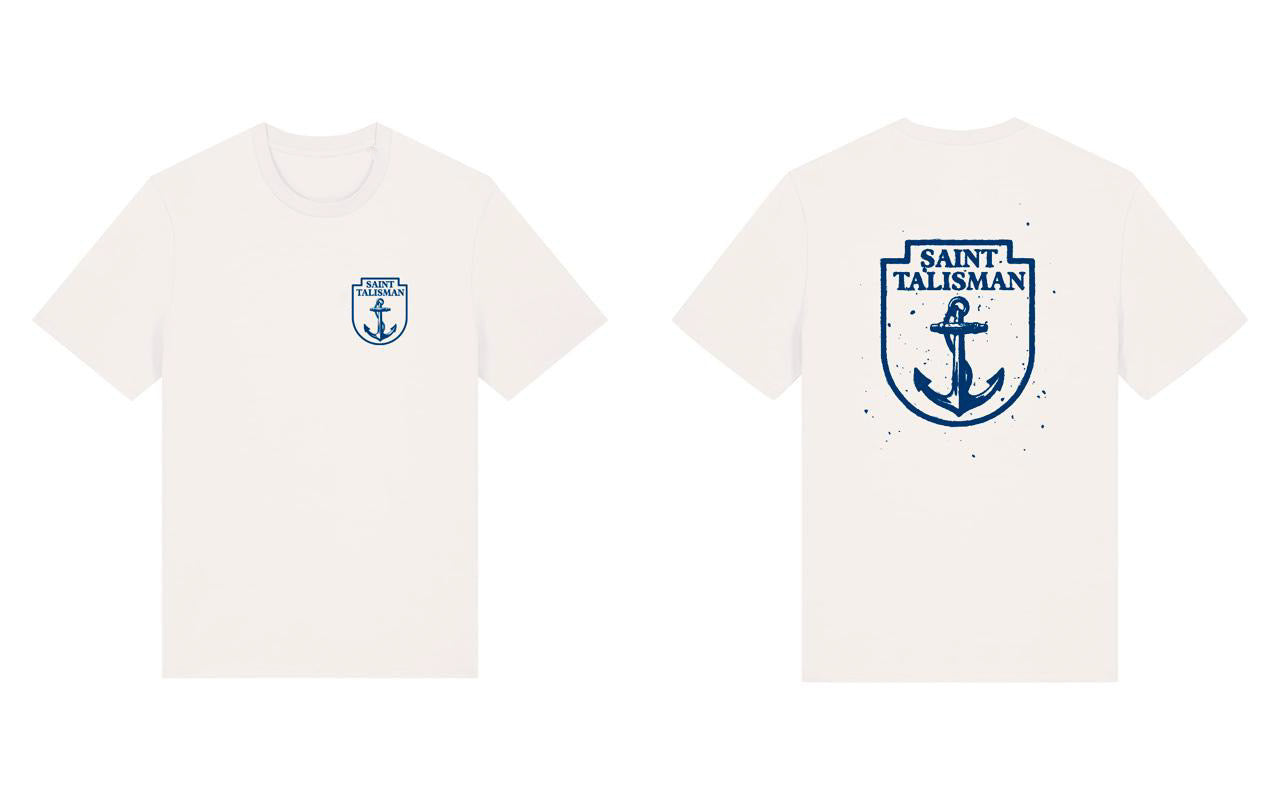 THE SHIELD TEE — ANCHOR EDITION - Vintage White features a small blue anchor and Saint Talisman text on the front left chest; the back displays a large anchor graphic with bold blue Saint Talisman text above.