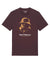 The S.T Gas Mask Tee - Brown features a yellow-orange graphic of a person in a bucket hat and gas mask, with "Saint Talisman" and "FORTITUDE PREVAILS" printed boldly below the image.